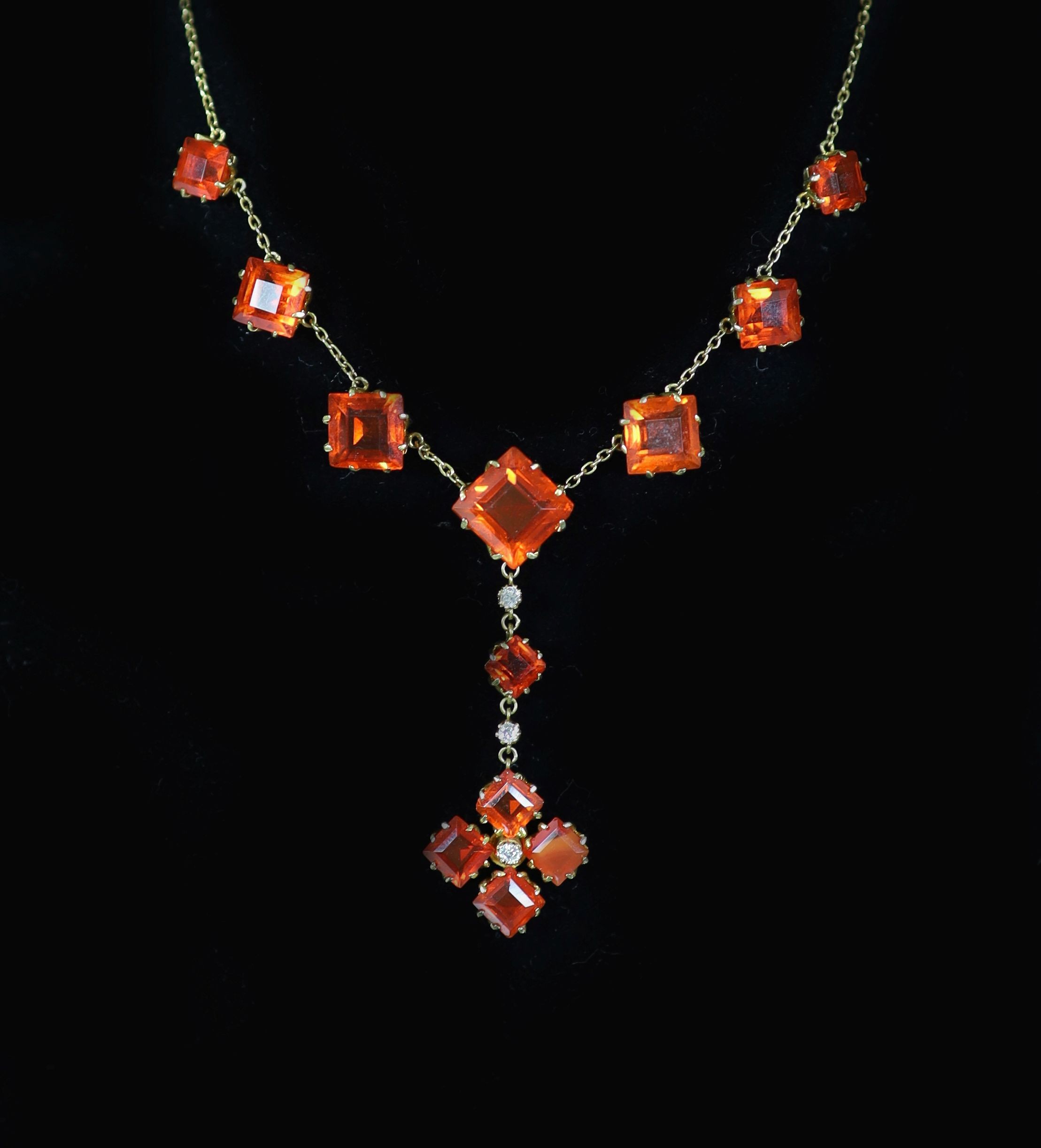 An early 20th century gold, fire opal and diamond drop necklace